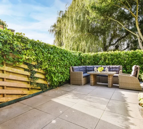 cozy-outdoor-patio-with-greenery-and-comfortable-s-2026-03-18-08-16-57-utc